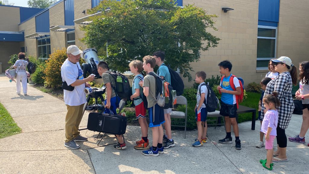 Students lining up for safe sunspot observation