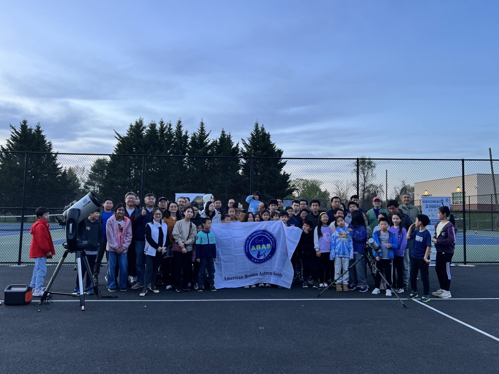 Participants in the Longfellow Middle School sidewalk astronomy event posing for a group photo