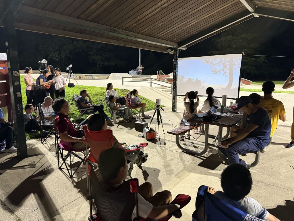 Participants listening to an astronomy talk after dark at Lake Fairfax Park