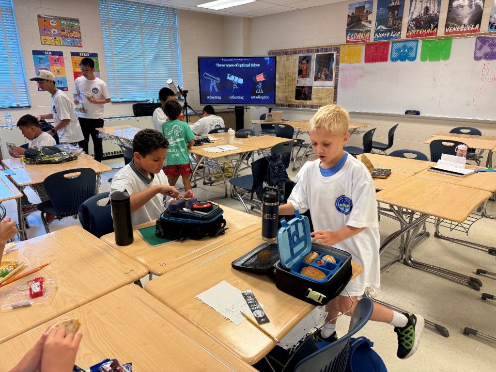 Elementary campers at their desks in the camp classroom